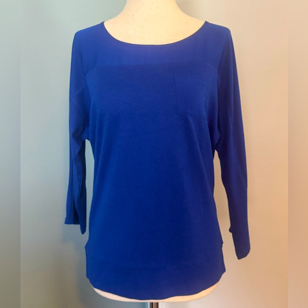 Chico’s lady size 0. Royal blue three-quarter length sleeve top. New with tags!